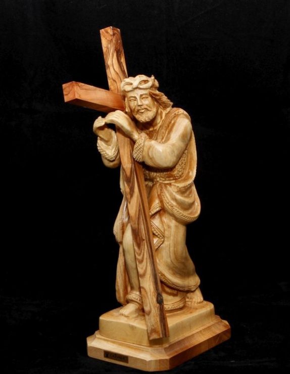 Jesus holding the cross standing