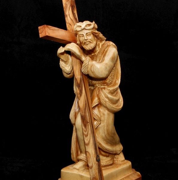 Jesus holding the cross standing 1